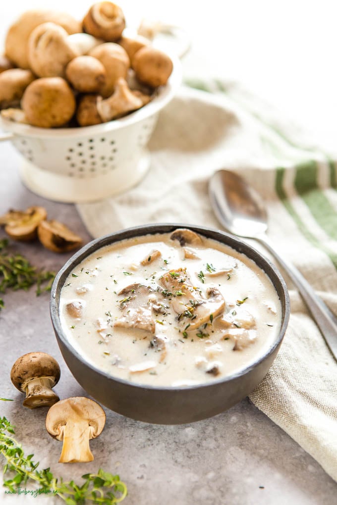 bowl of mushroom soup with fresh thyme