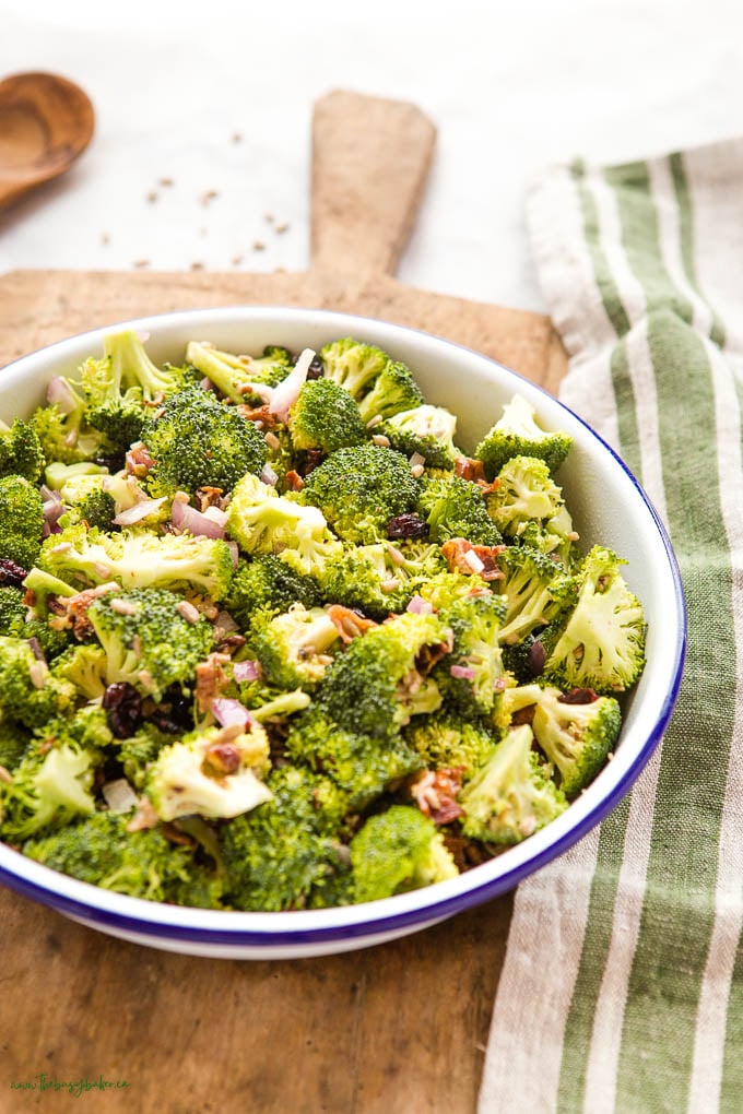 fresh broccoli salad with bacon, red onion, and cranberries