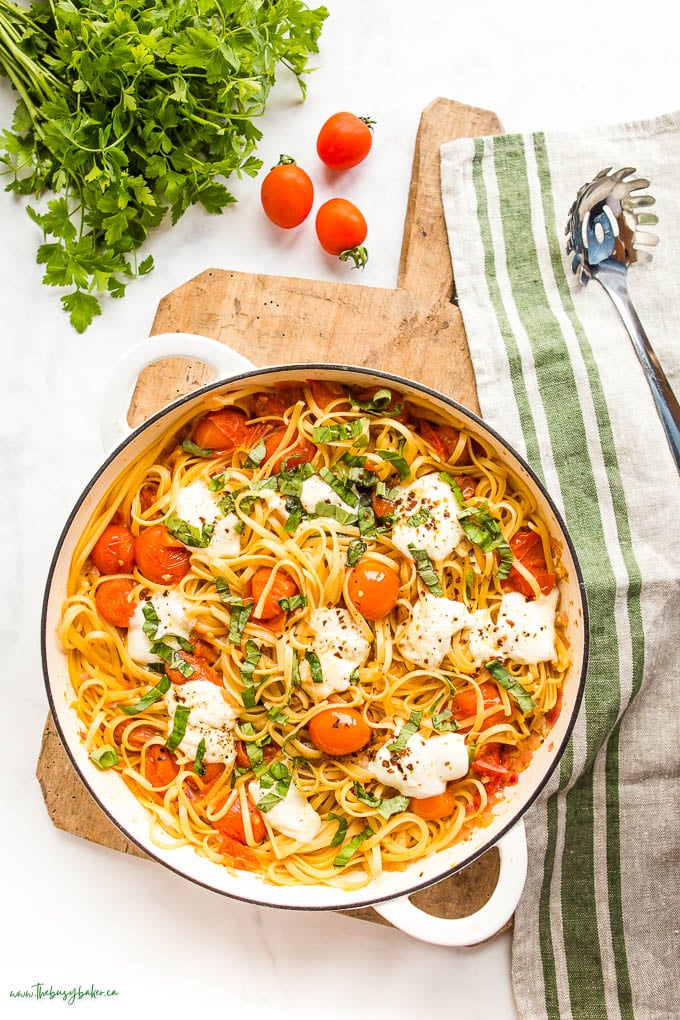 overhead image: one pot pasta with tomatoes, basil and mozzarella