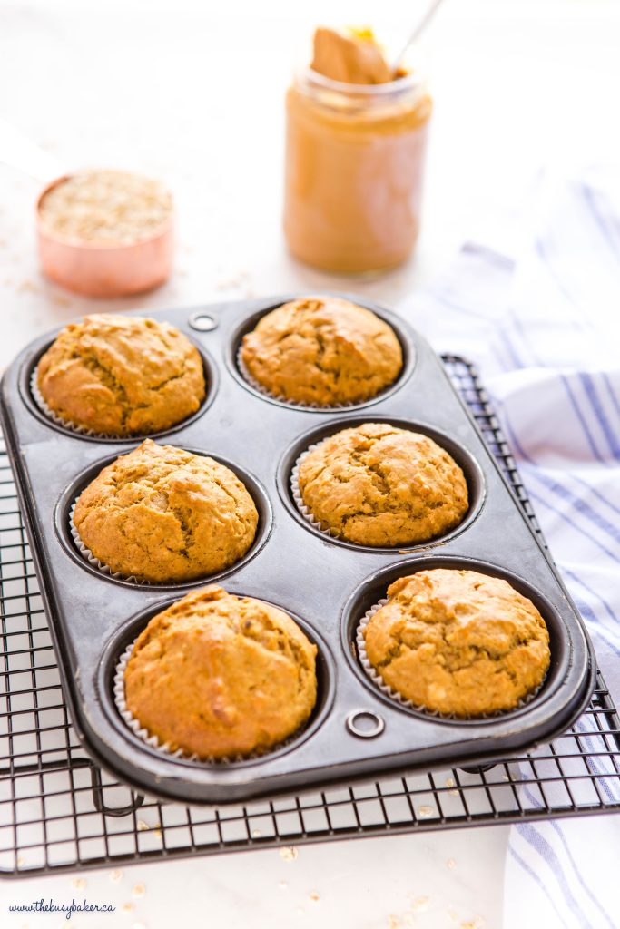 peanut butter muffins with banana and oats in muffin tin