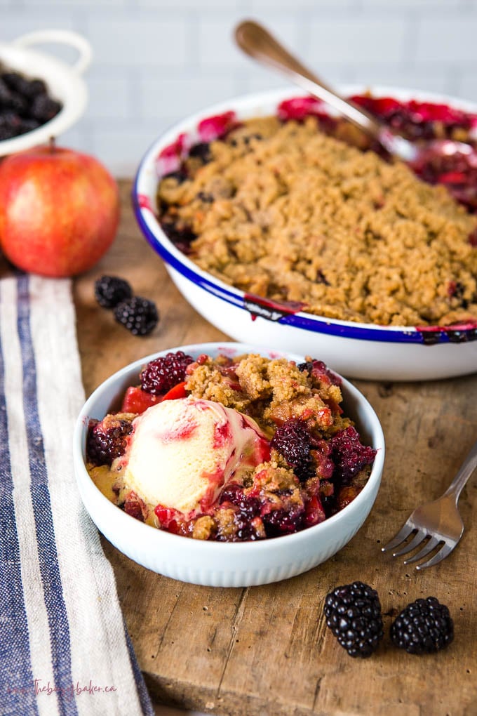 fruit crumble with apples and blackberries and ice cream
