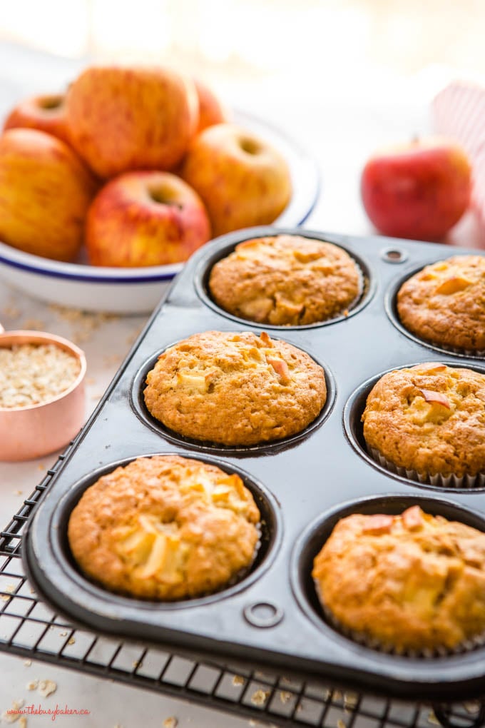 muffin tin with apple oat muffins