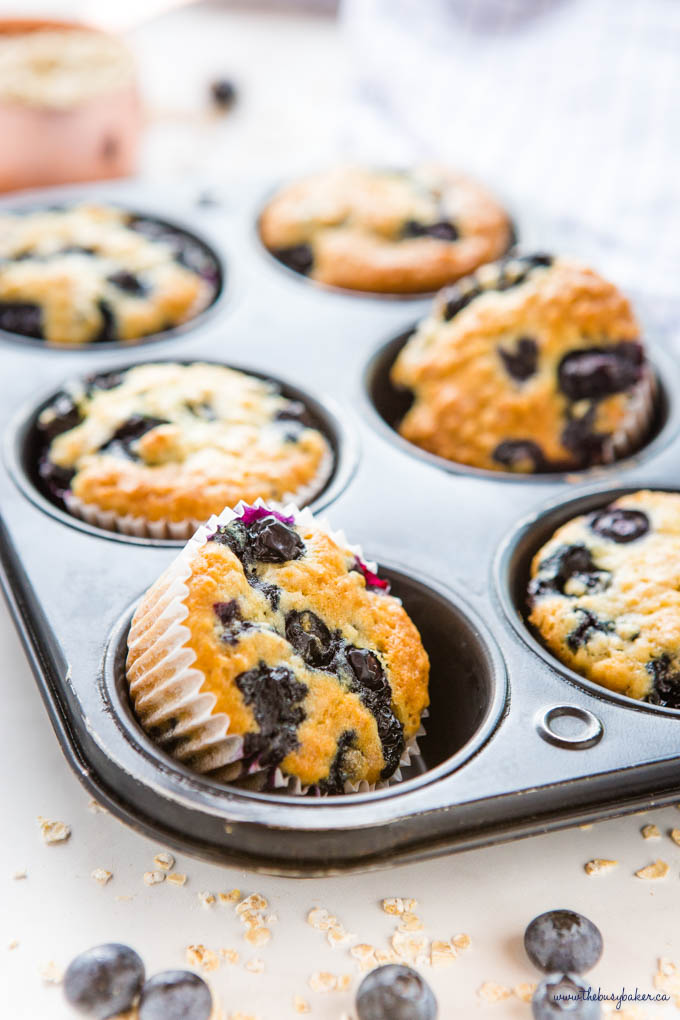 muffins with oats and blueberries in muffin tin