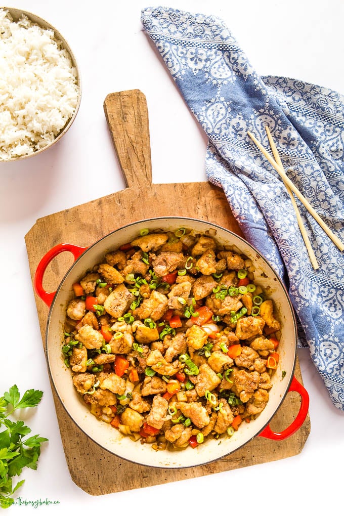 overhead image: red cast iron pan with crispy asian chicken and vegetables