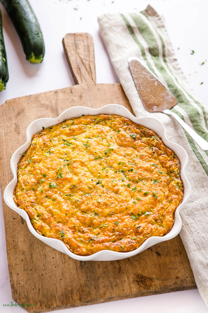 overhead image: zucchini quiche pie in white pie plate