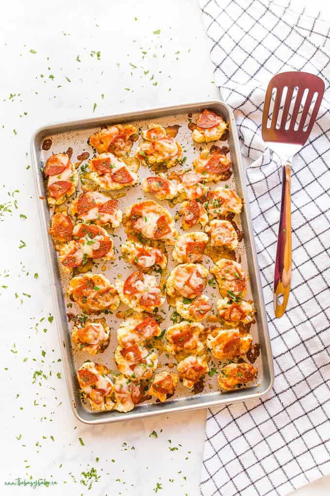 overhead image: roasted cauliflower with marinara sauce, cheese, and pepperoni