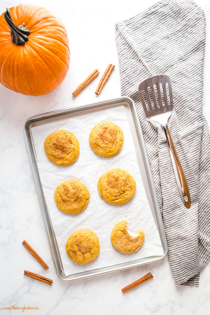 overhead image: pumpkin cheesecake cookies on baking sheet
