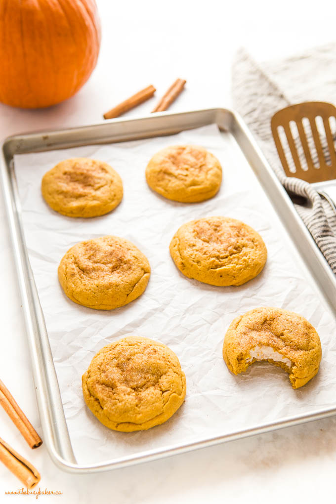 pumpkin cheesecake cookies on baking pan