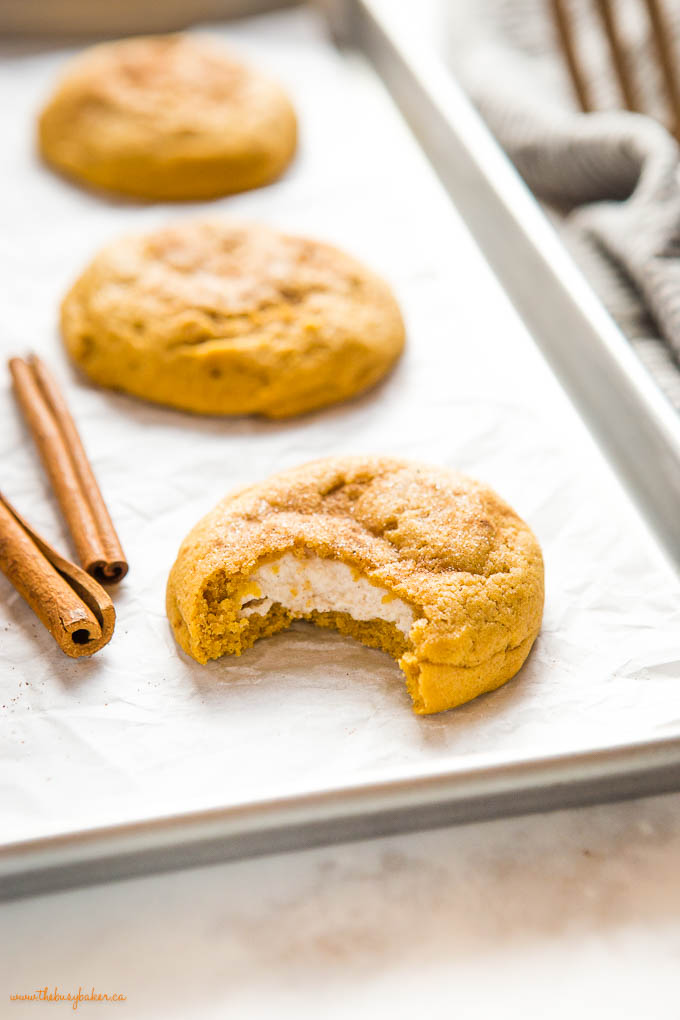 closeup image: pumpkin cookie with cheesecake filling