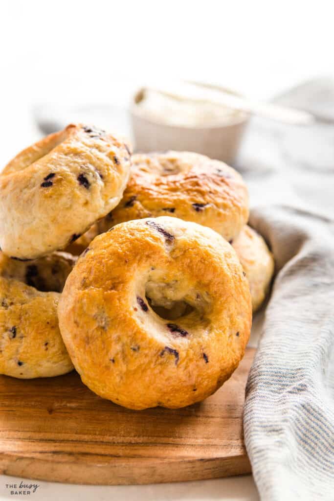 blueberry bagels on cutting board