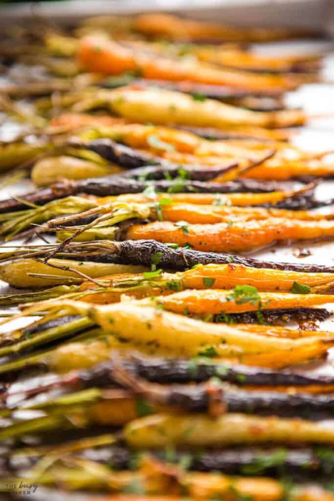 orange, white and purple carrots roasted on sheet pan