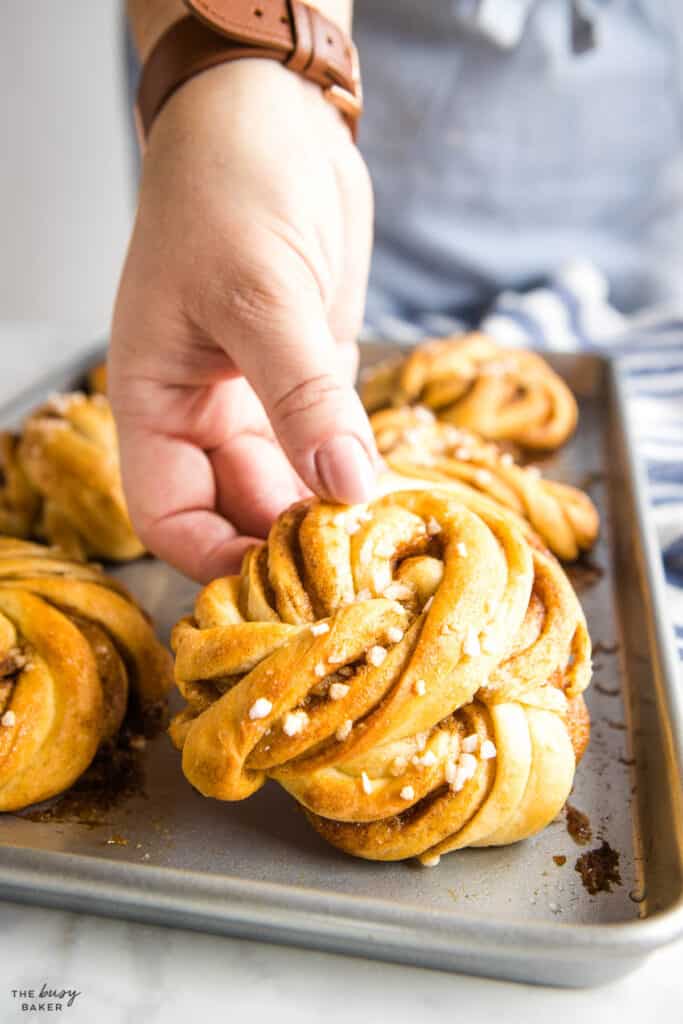 hand holding Swedish cinnamon bun twist