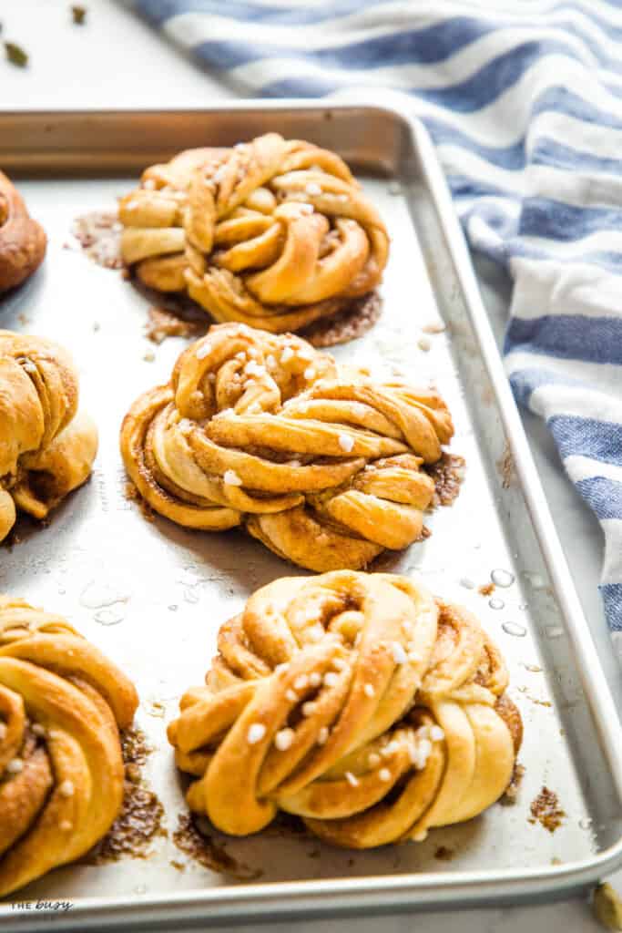 Swedish cinnamon twist buns on baking sheet