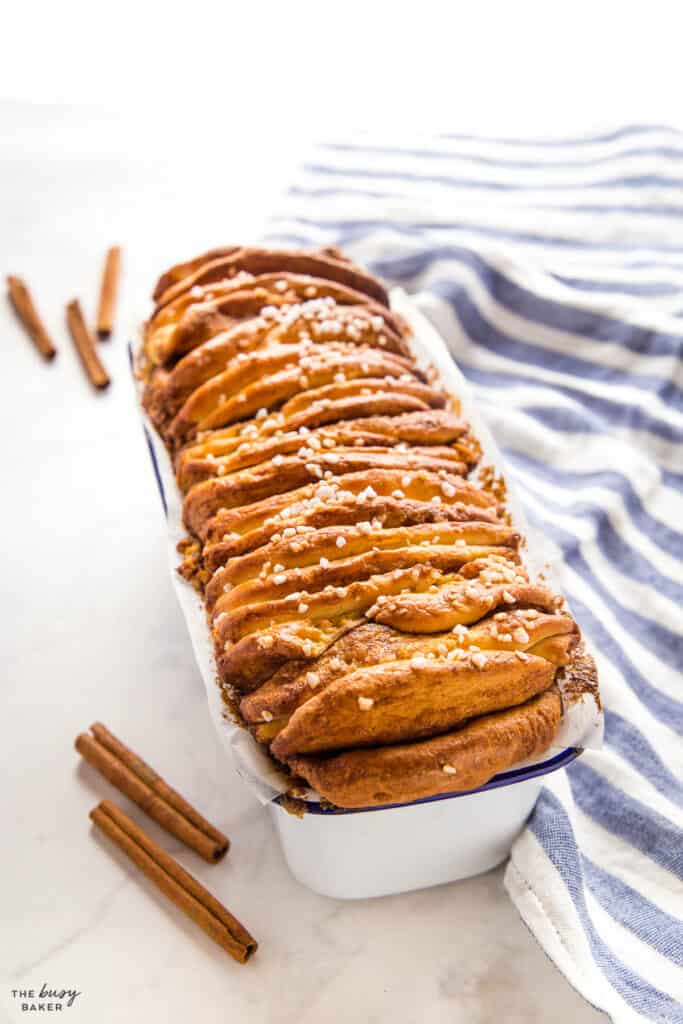pull apart bread with cinnamon sugar in white loaf pan