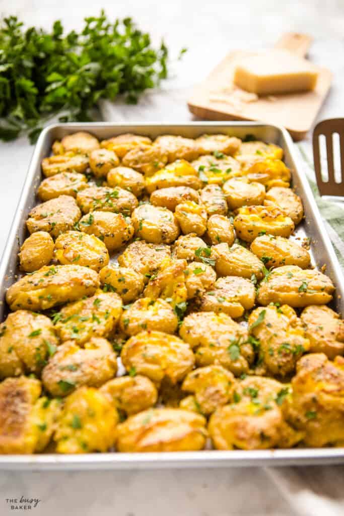 sheet pan crispy smashed potatoes with parmesan and herbs