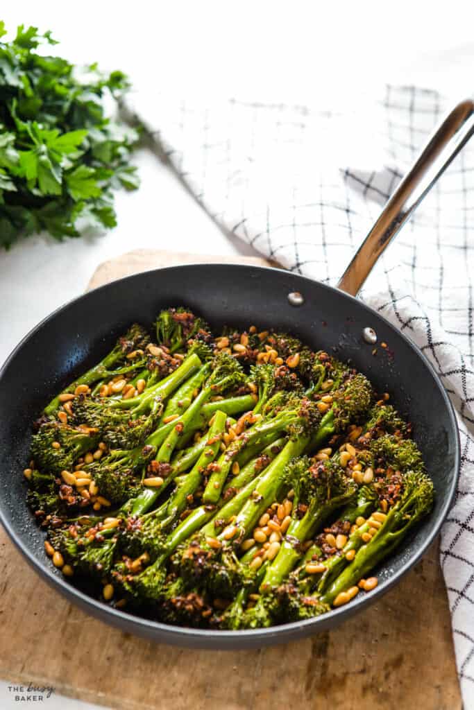oven-safe pan with roasted broccolini