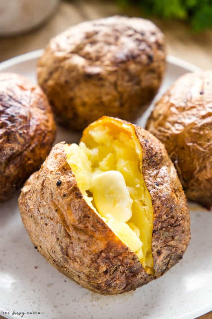 melting butter on air fryer baked potato