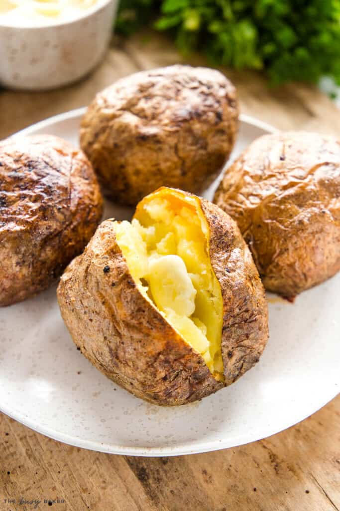 baked potato on plate with butter