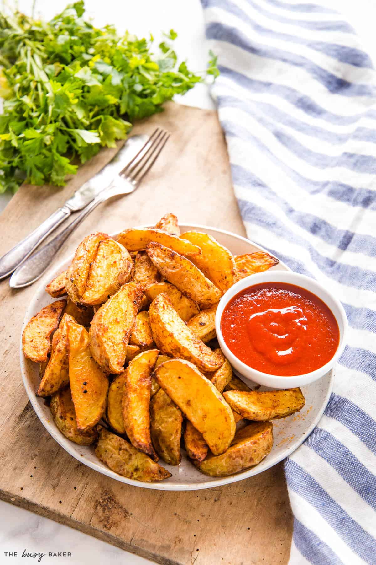 plate of crispy potatoes with ketchup