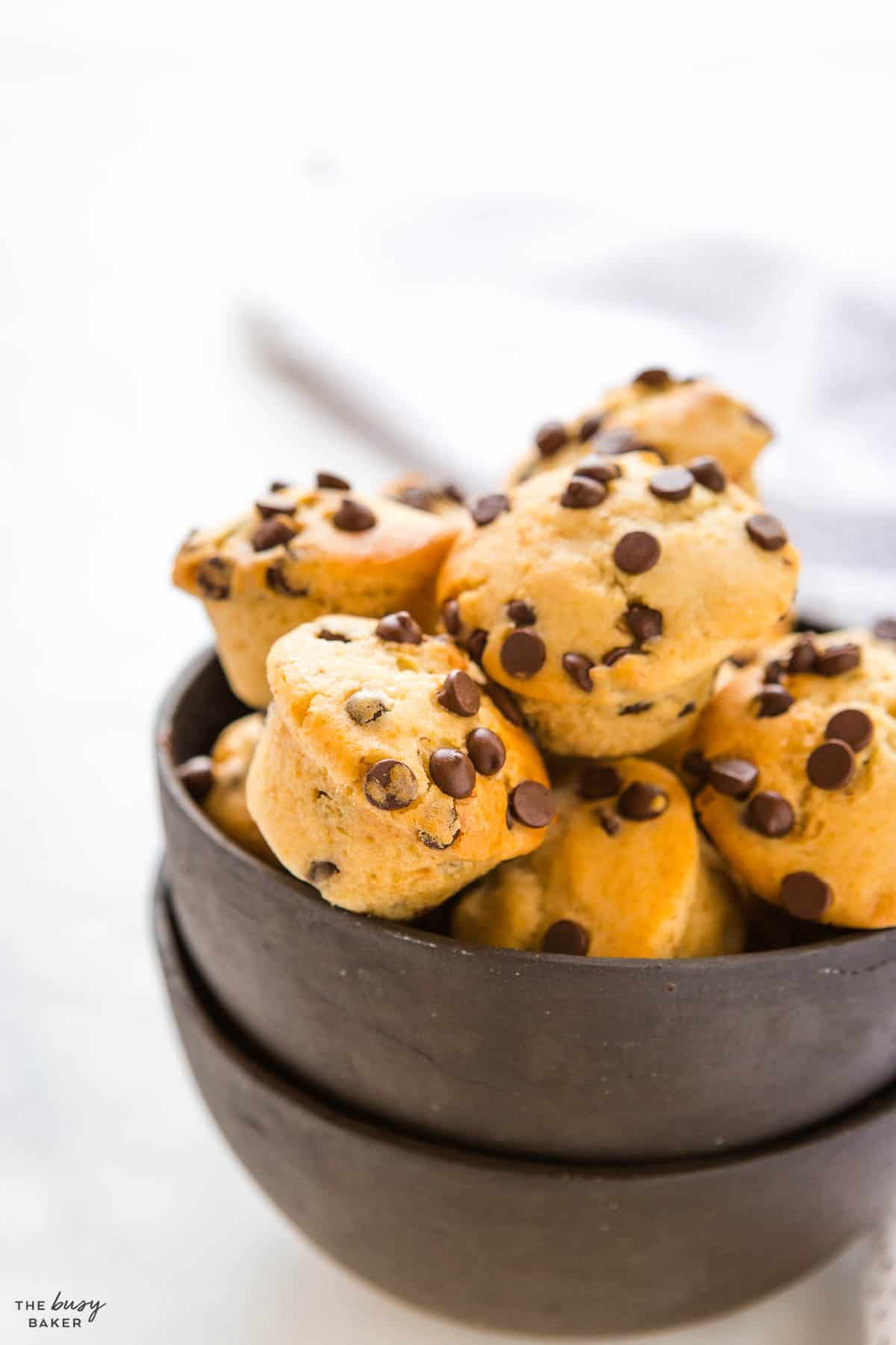 mini muffins with chocolate chips in a black bowl