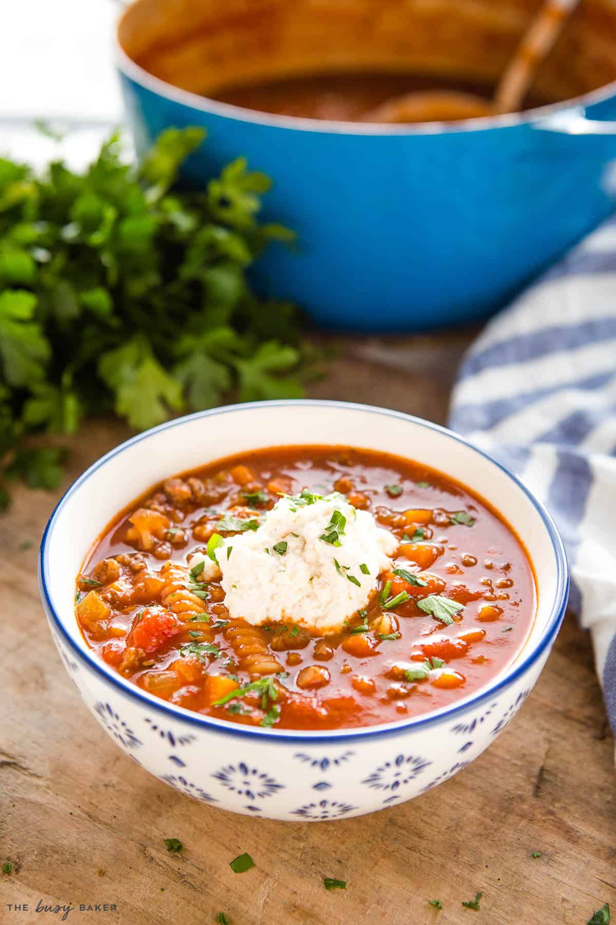 bowl of Italian-style soup with tomatoes, beef, veggies and pasta