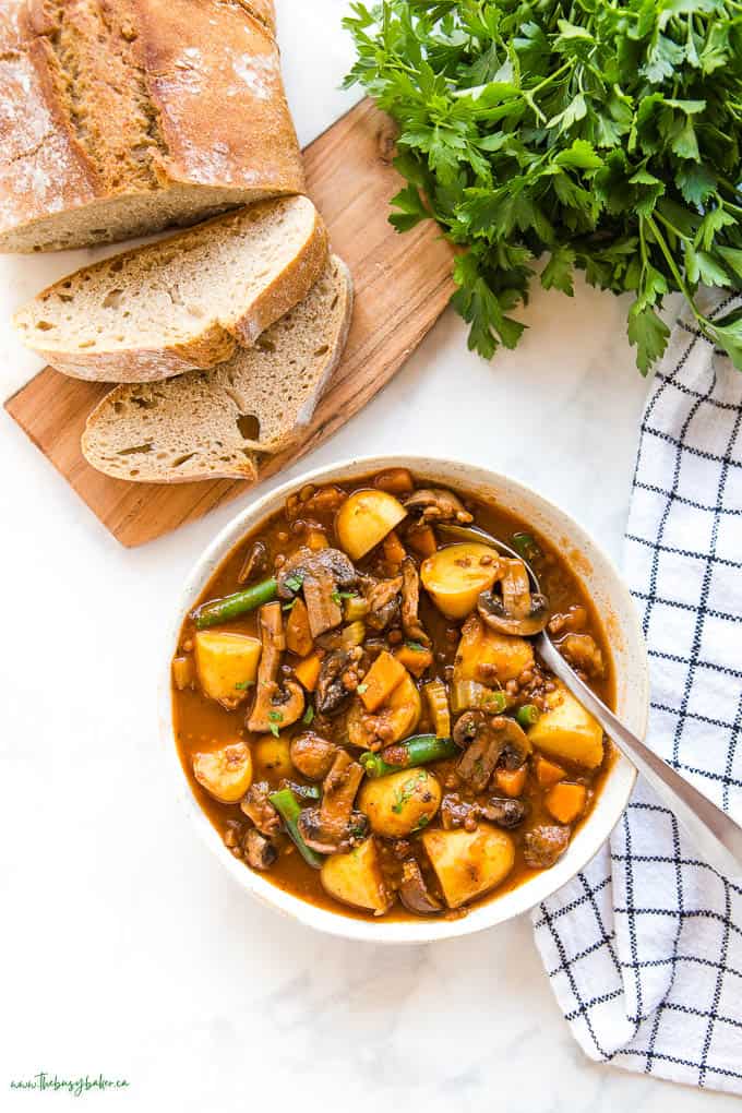 overhead image: bowl of vegetable stew with spoon