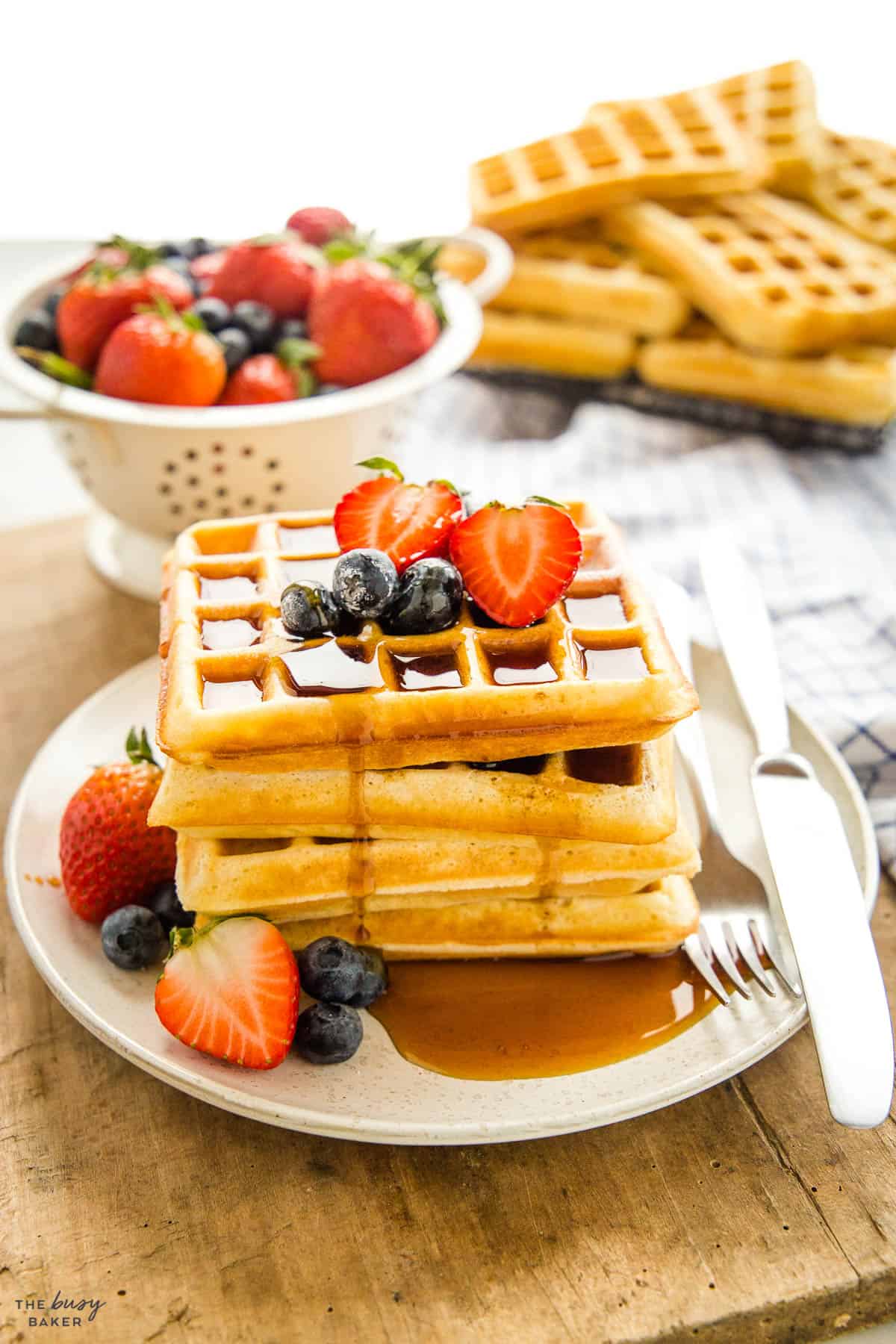 waffles with fruit and maple syrup
