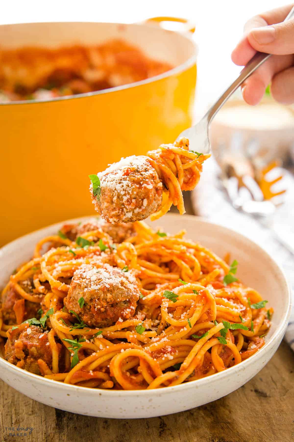 fork holding spaghetti and meatballs