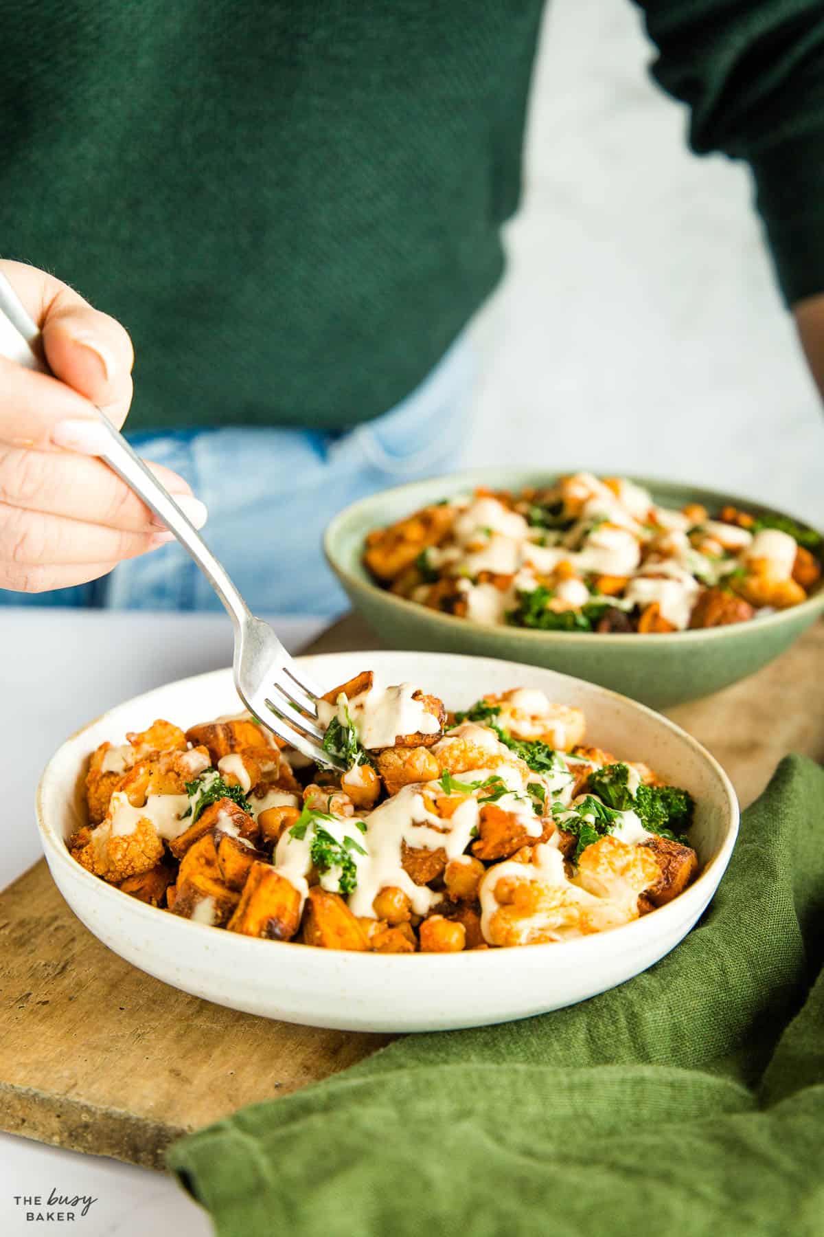 woman eating a plant-based power bowl