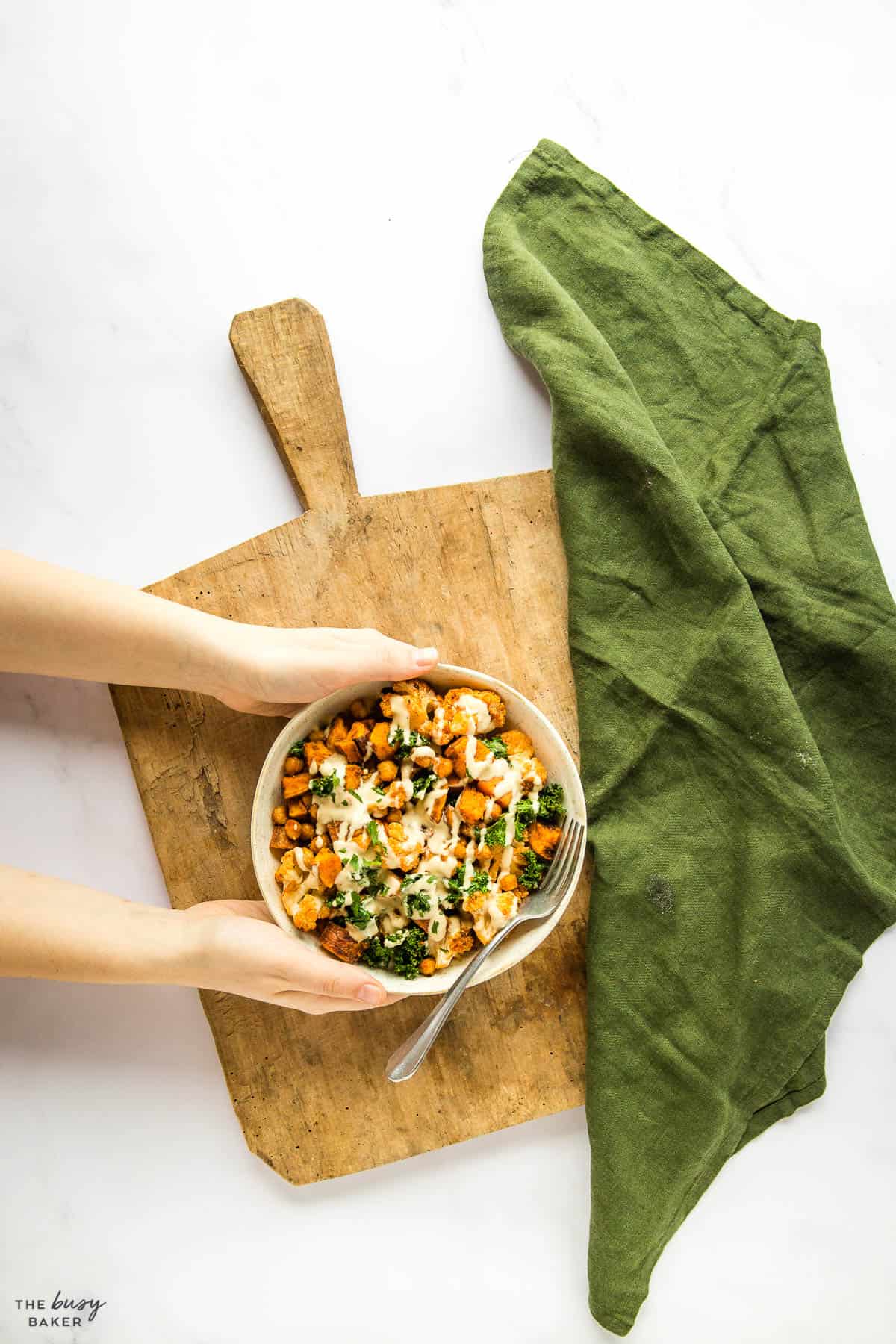 overhead image: power bowl with cauliflower, kale, chickpeas and sweet potatoes