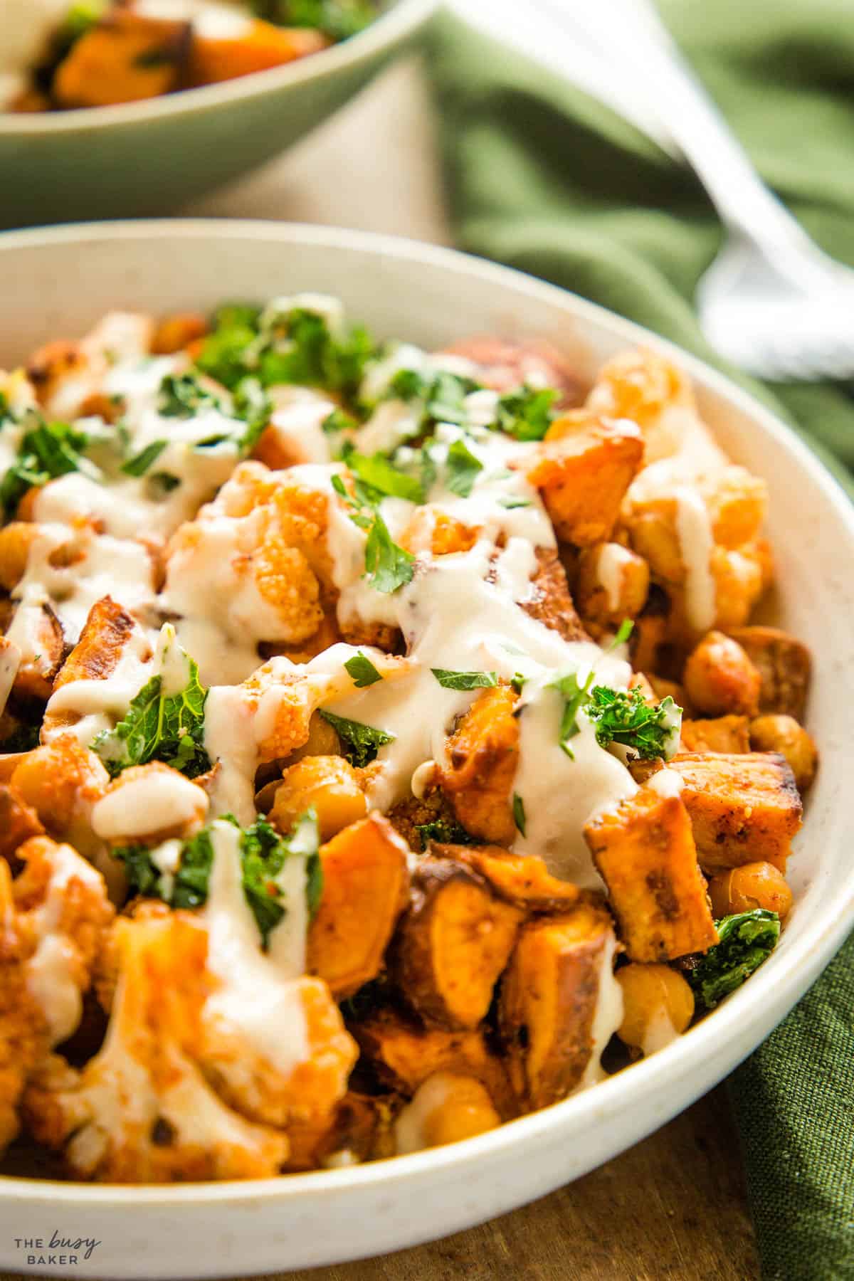 closeup image: veggies with tahini sauce