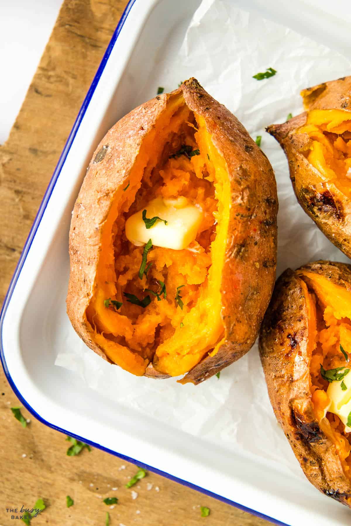 closeup image: baked yam with crispy skin and butter