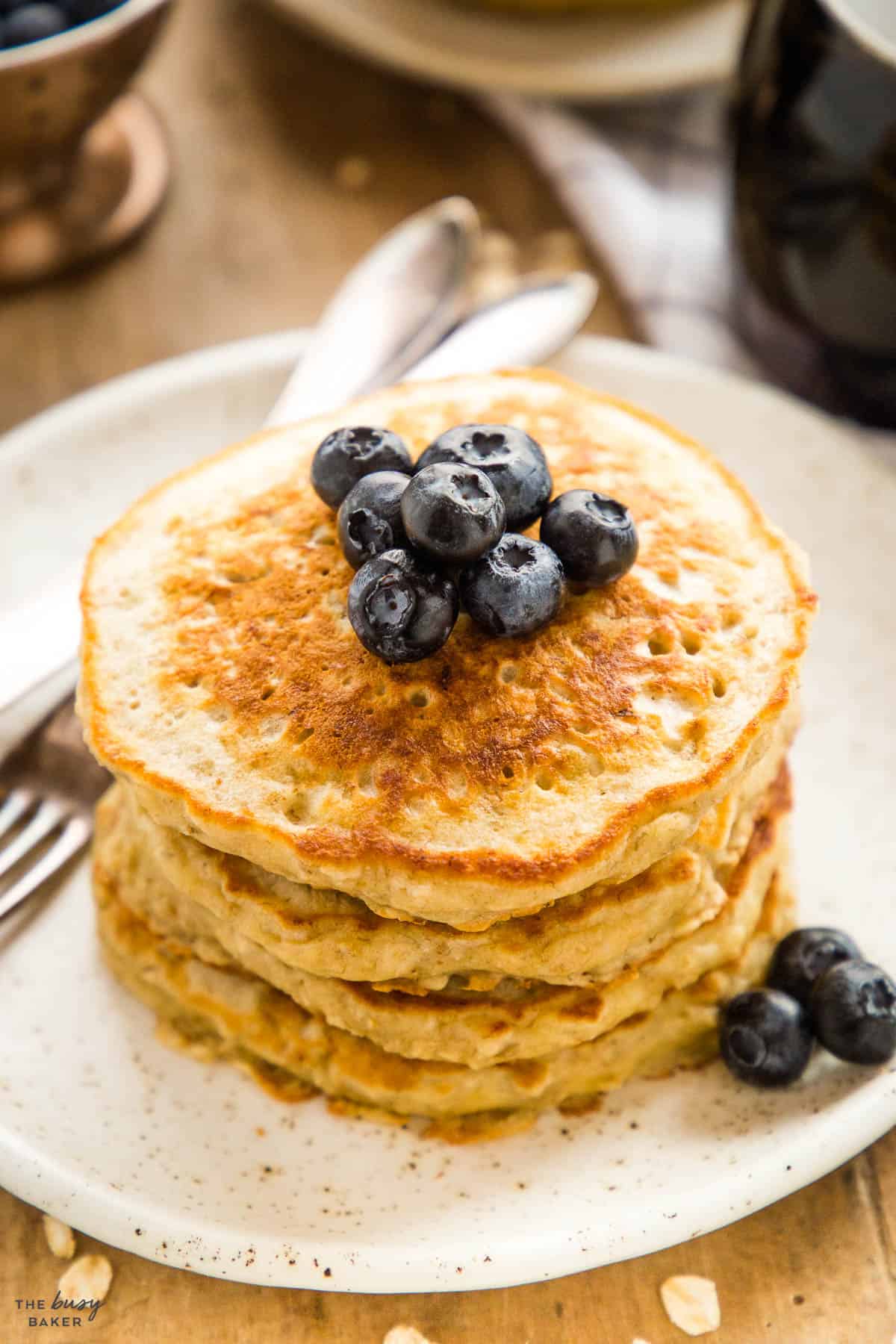 stack of banana pancakes with blueberries