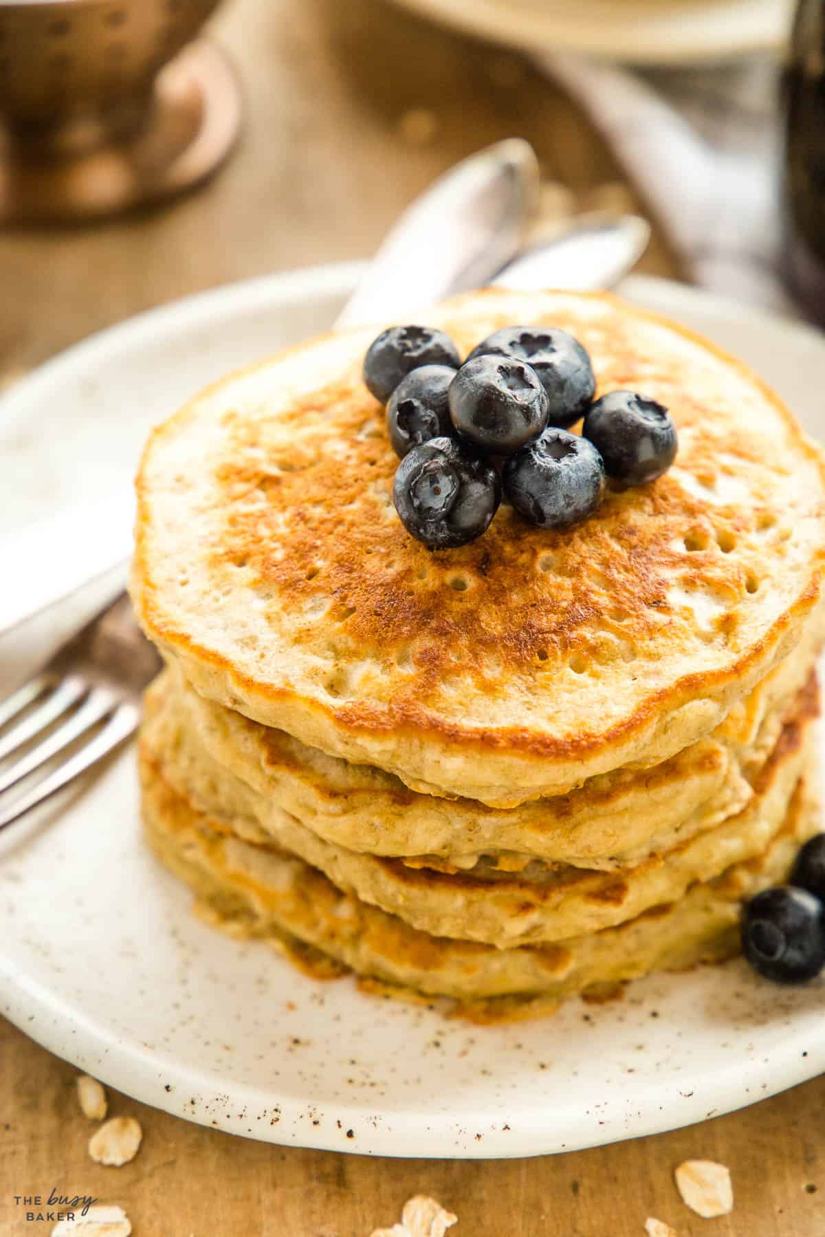 stack of banana pancakes with blueberries