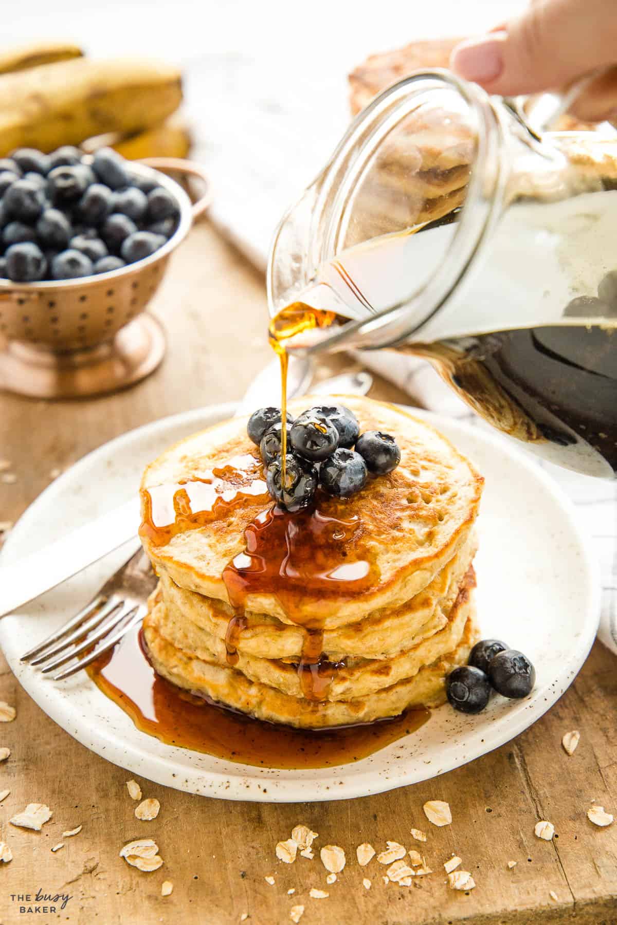 hand pouring maple syrup 