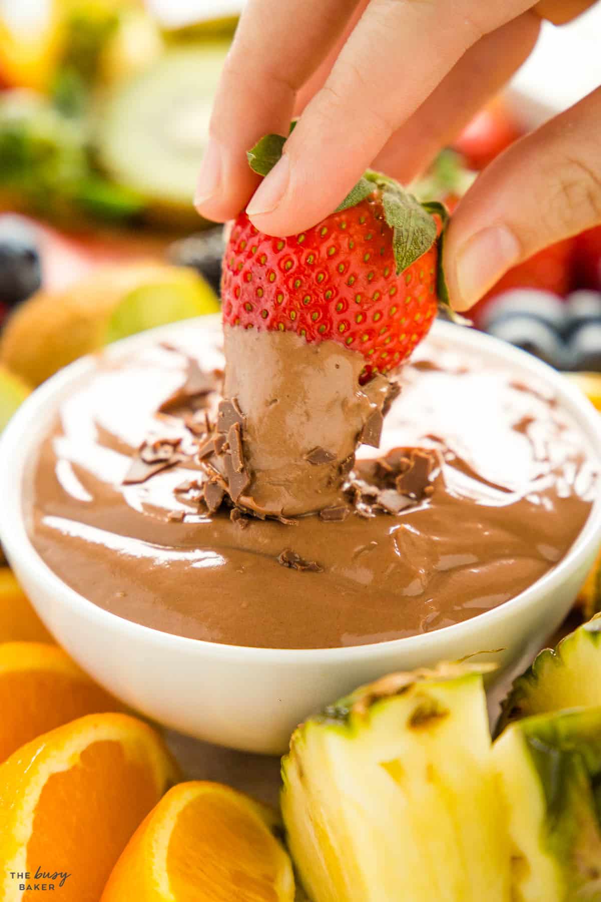 strawberry dipping in chocolate yogurt