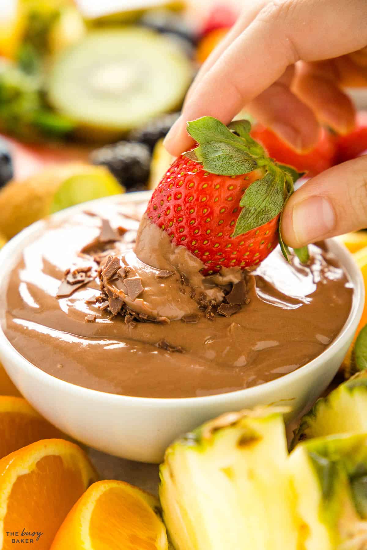 strawberry dipping in chocolate yogurt