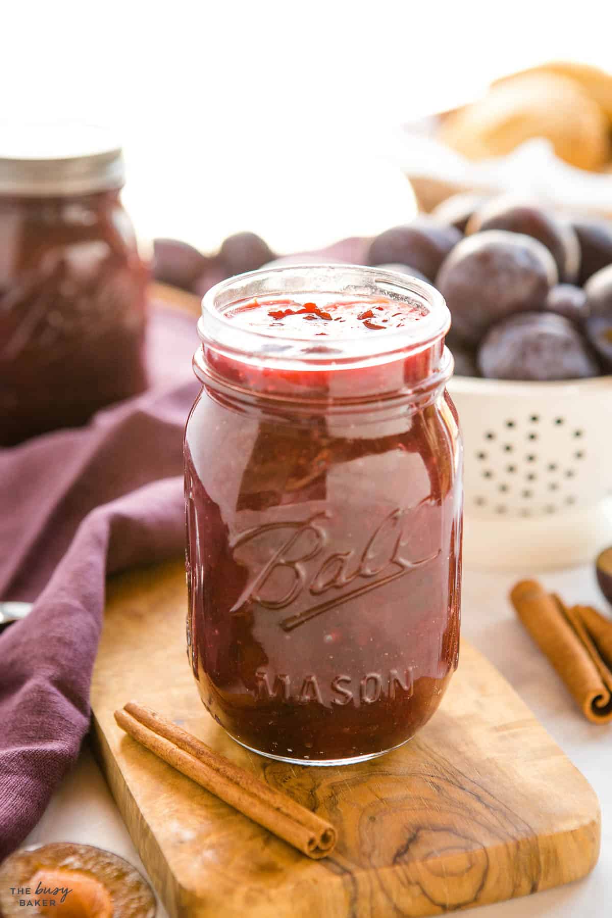 jar of preserves with fresh fruit and cinnamon