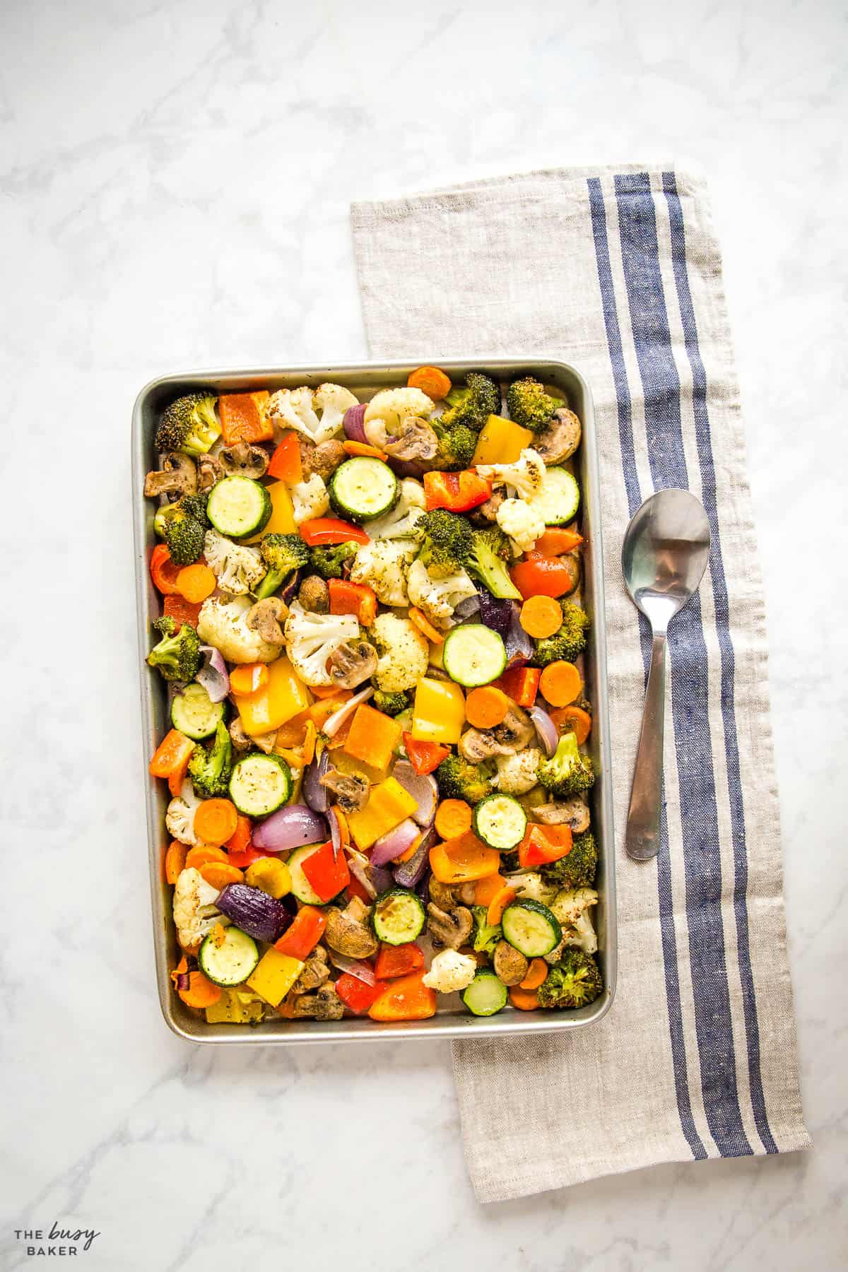 overhead image: roasted vegetables on a sheet pan