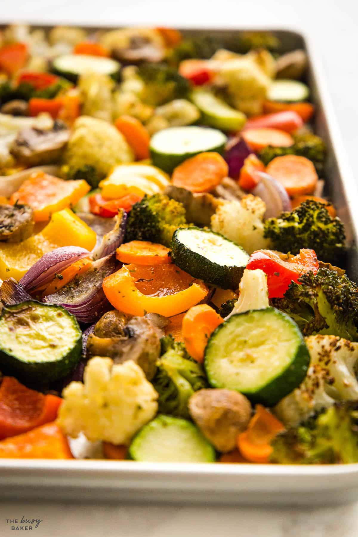 oven roasted zucchini, peppers, onions, mushrooms, broccoli and carrots on a sheet pan