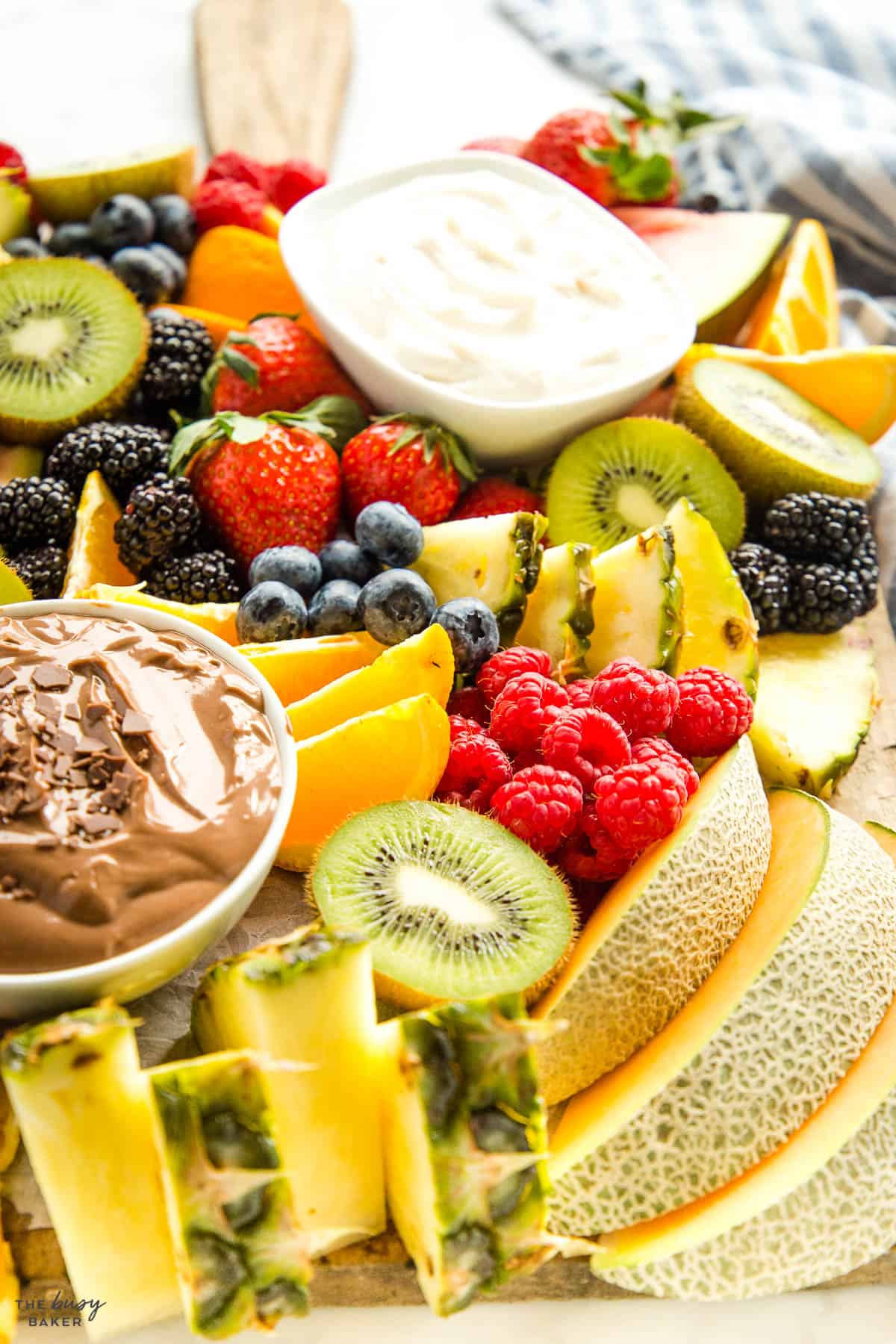 cantaloupe, berries, kiwis and fruit dip