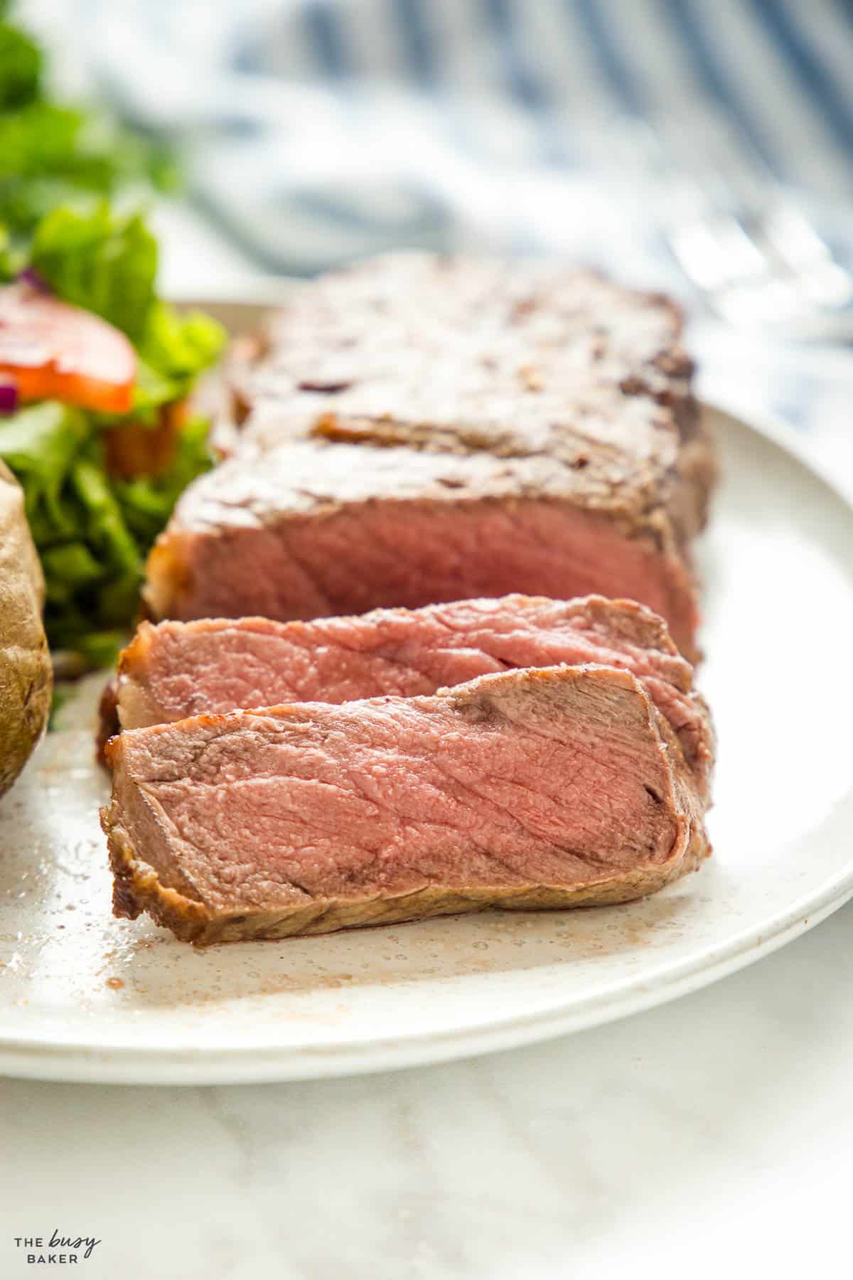 medium rare steak on white plate