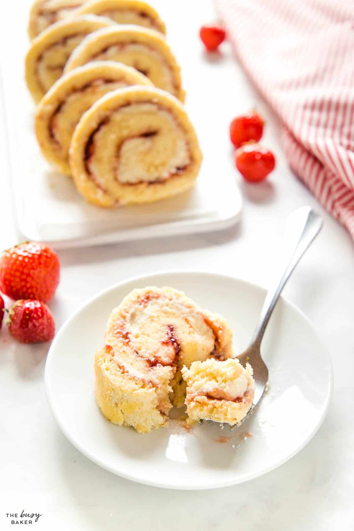 slice of vanilla swiss roll cake with strawberry jam