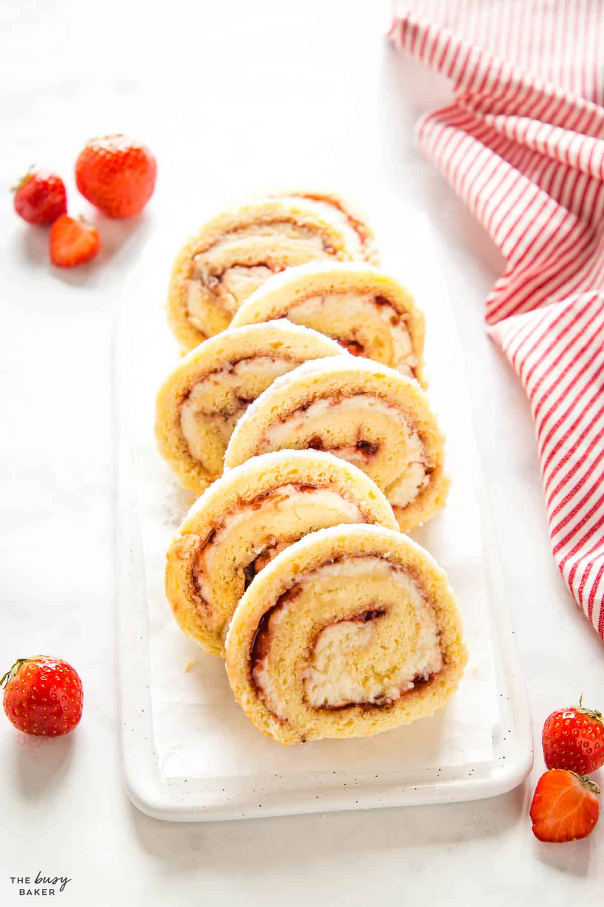 rolled vanilla dessert with strawberry jam and cream