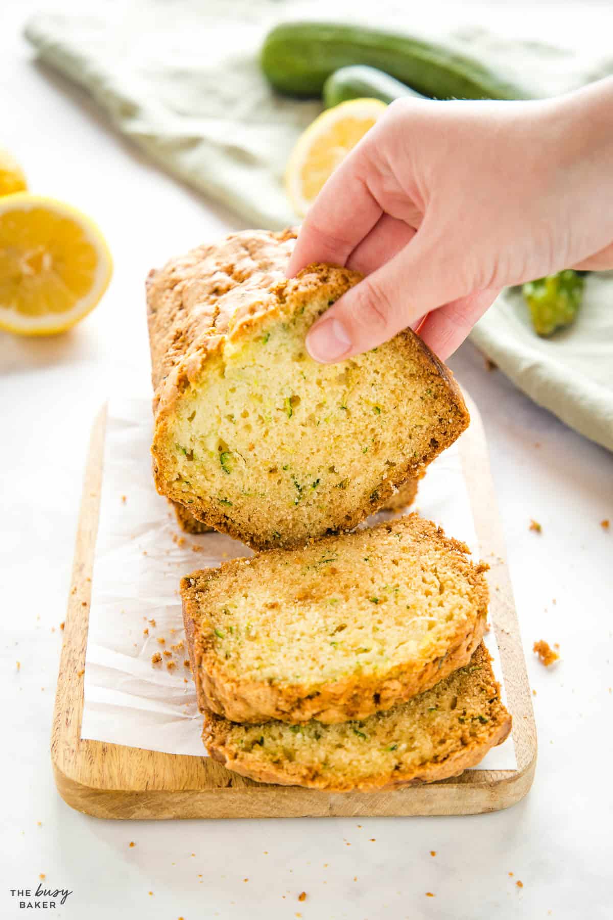 hand holding slice of zucchini bread