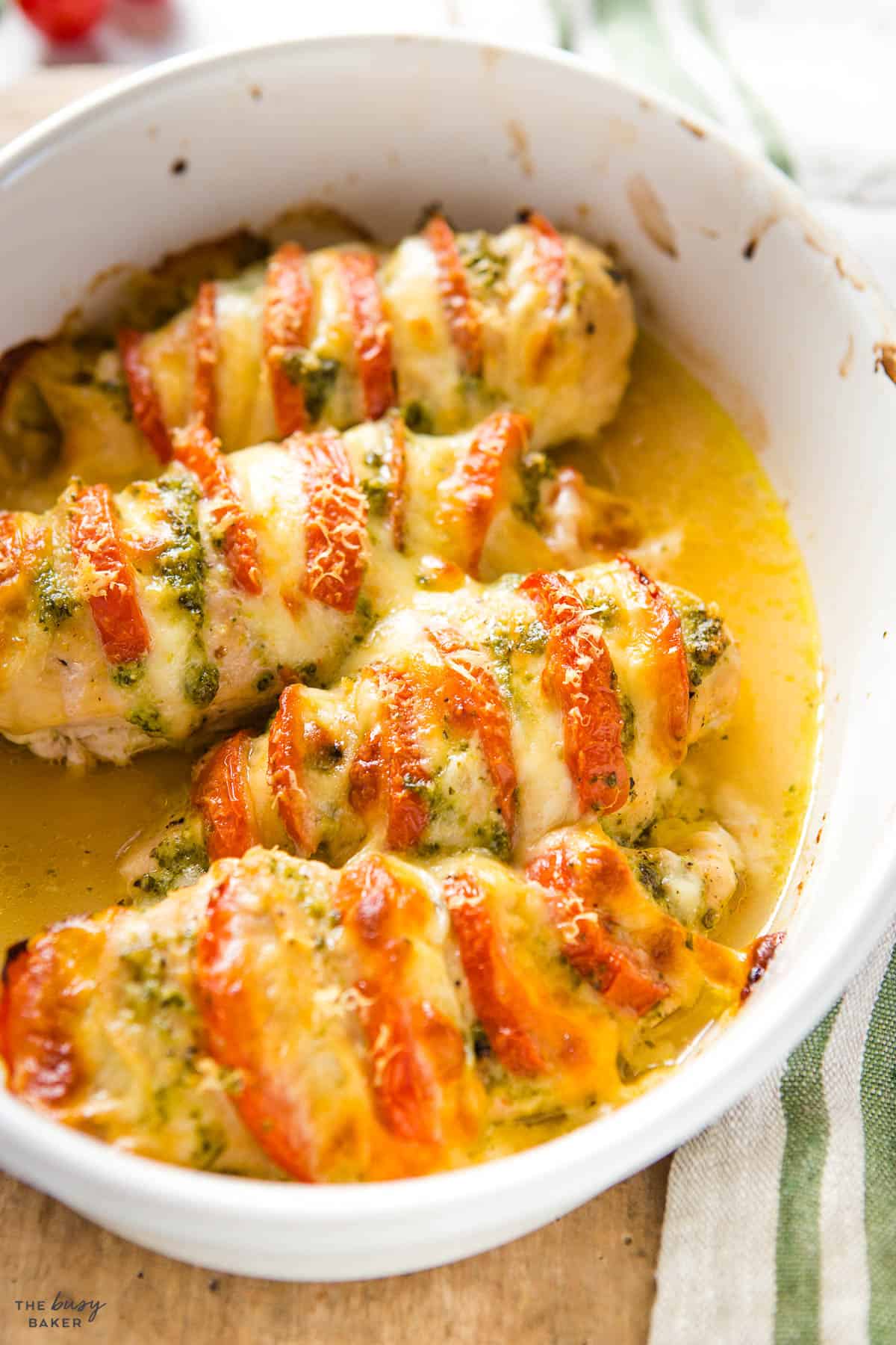 hasselback chicken with pesto, tomatoes and cheese