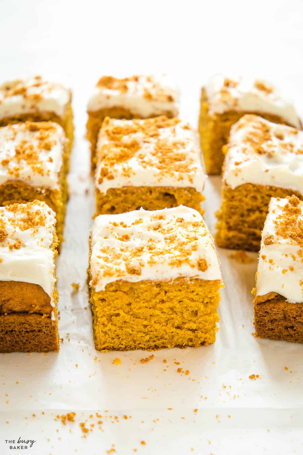 slice of pumpkin cake with white frosting