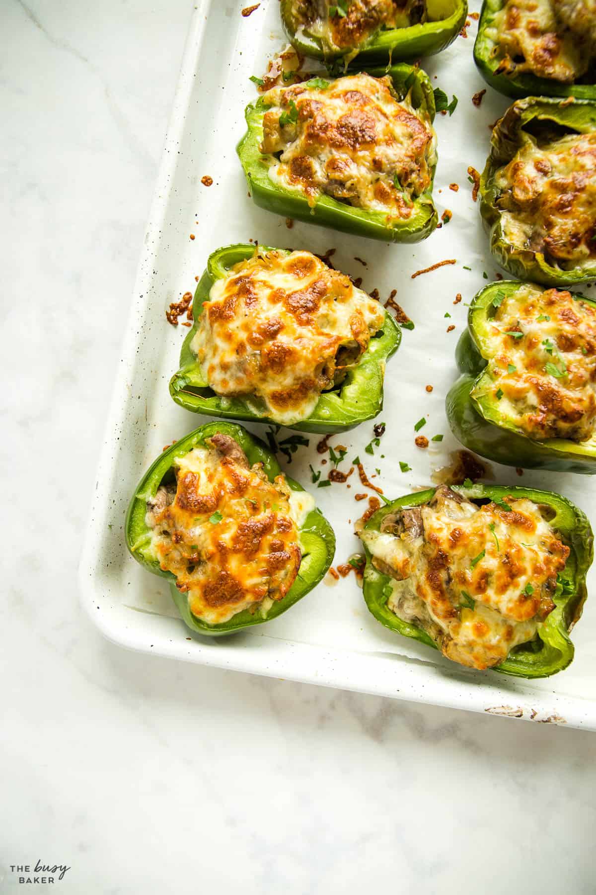 overhead image: stuffed peppers with melted cheese