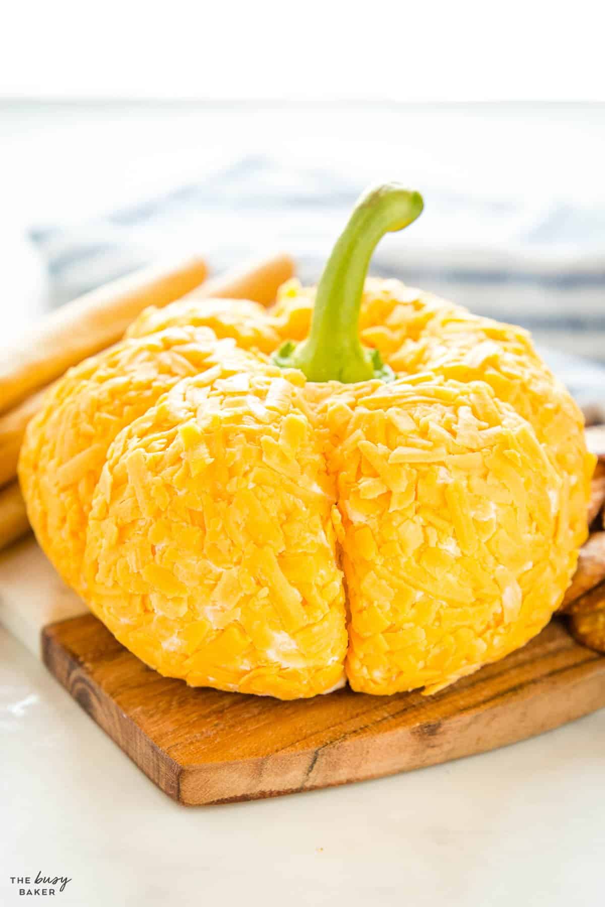 pumpkin cheese ball on cheese board