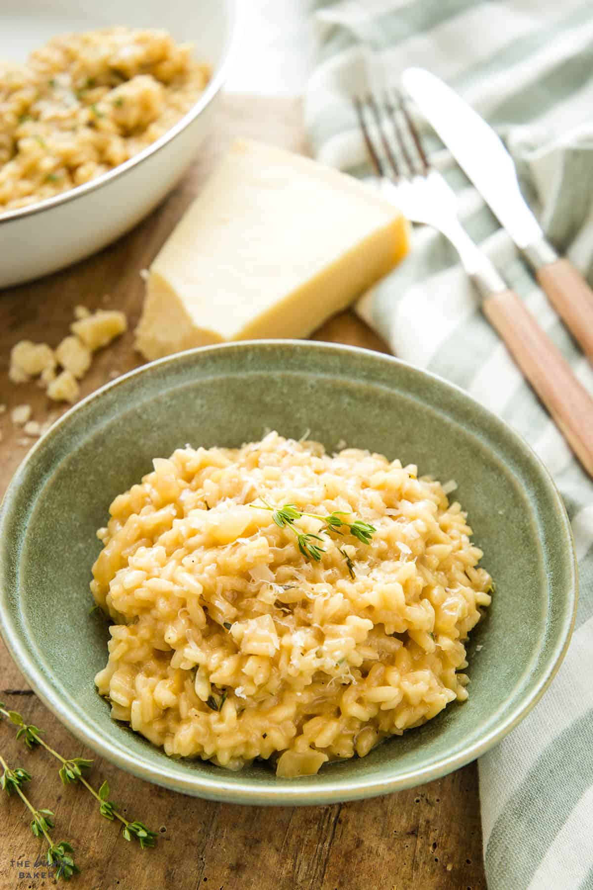 homemade risotto in a green bowl with parmesan